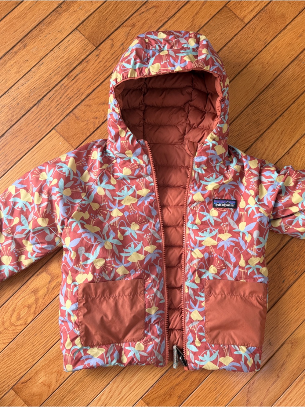 Reversible Patagonia Kids Floral Hooded Puffer Jacket in Rust and Yellow